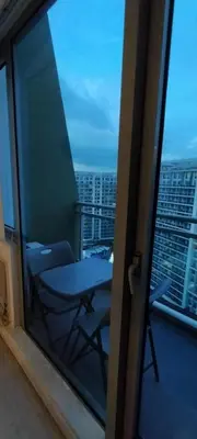 a view from a window of a balcony with a table at Azure Cozy Vibe Condo Unit in Manila