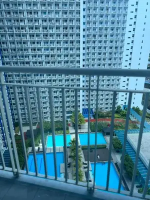 a view from the balcony of a large apartment building at JAZZ RESIDENCES- Amaya Stays in Manila