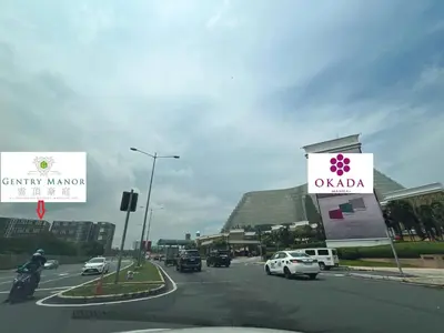 a street with cars driving down a road with signs at Gentry Manor Near MOA&Airport WiFi TV Netflix Okada view 6Q in Manila