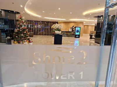a christmas tree in the lobby of a shopping mall at Velvet Room near MOA with a Cozy, Comfy Bed in Manila