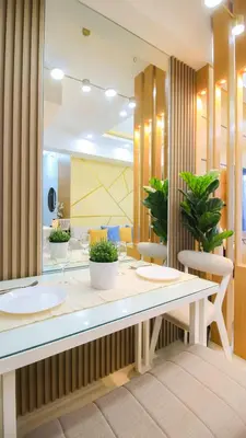 a room with a table with plants on it at Cylo's Place Manhattan in Manila