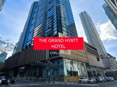 a large building with a sign that reads the grand hyatt hotel at Prime 1br Condo Infront Grand Hyatt BGC #oursw20d1 in Manila
