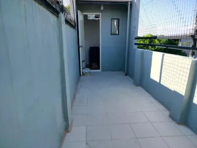 a hallway with a tiled floor in a building at Simple, Spacious Home To Stay, 2Bedrooms 2 Toilet & Bath 1 car garage in Uldugan