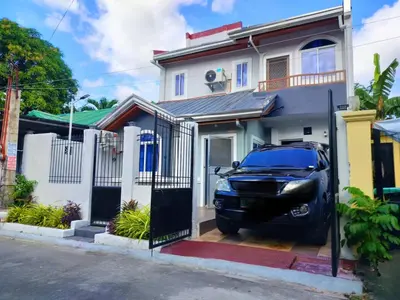 a car parked in front of a house at Simple, Spacious Home To Stay, 2Bedrooms 2 Toilet & Bath 1 car garage in Uldugan