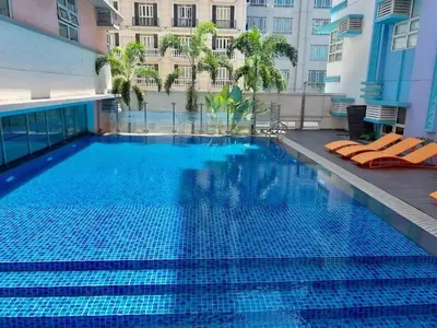 a large swimming pool on the side of a building at Newport 101 - East Wing in Manila