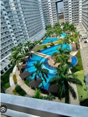 an aerial view of a resort with palm trees at Shell Residences in Manila