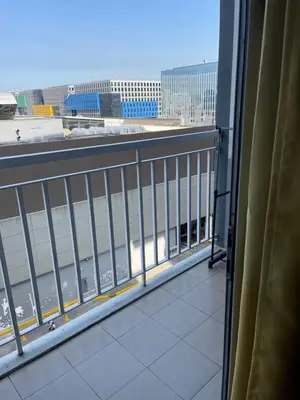 a balcony with a view of a building at Shell Residences in Manila