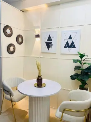 a white table and chairs in a room at NEAR NAIA TERMINAL 1, 2, 3 Cozy Apartment at Field Residence in Manila