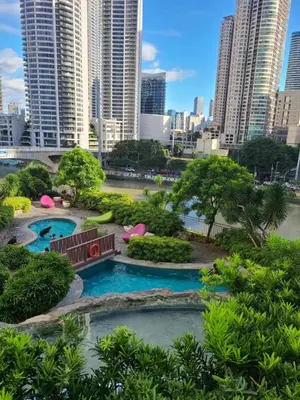 a view of a park in a city with tall buildings at Staycation in Mandaluyong near Makati and BGC in Manila