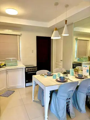a kitchen with a white table and chairs in it at Havila, Amarilyo Home, Brgy San Juan, Taytay Rizal in Taytay