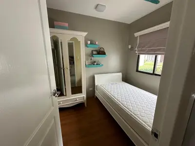 a small bedroom with a bed and a mirror at Havila, Amarilyo Home, Brgy San Juan, Taytay Rizal in Taytay