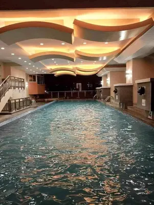 a large pool of water in a hotel room at Birch Tower Malate Manila by T&T in Manila