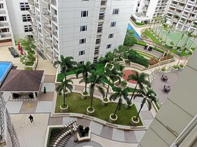 an overhead view of a courtyard with palm trees in a building at Condo Near MOA and NAIA at SoleMare Parksuites in Manila
