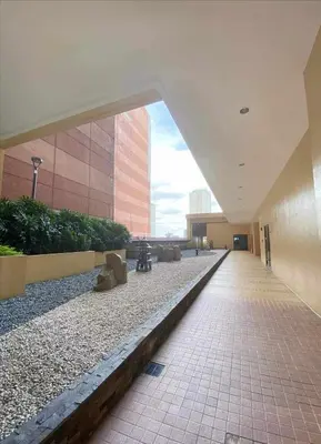 an empty hallway in a building with a building at Family budget room, infront US of Embassy in Manila