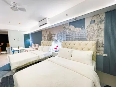 three beds in a room with a mural on the wall at Lovely Penthouse across City of Dreams, Airport in Manila