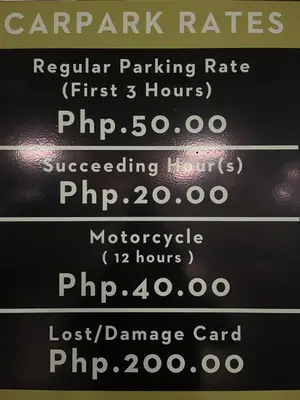 a menu of parking rates on a blackboard at Destina at Air Residences Makati MetroManila, Netflix in Manila