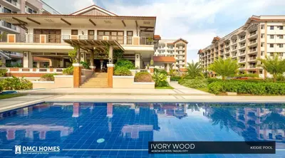 a swimming pool in front of a building at The Cozysweet Homestay in Manila