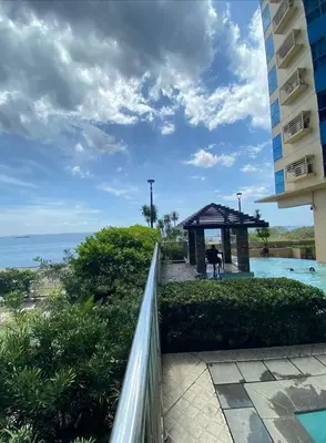 a view of the ocean from the balcony of a hotel at Cozy Studio typeunit in Manila
