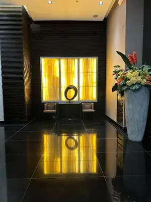 a room with a altar and a vase of flowers at 2 Bed Suite at Air Residences Condo, Ayala Ave Makati in Manila