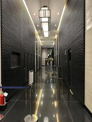 a hallway in a building with a long hallway at 2 Bed Suite at Air Residences Condo, Ayala Ave Makati in Manila