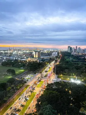 an overhead view of a busy city street at night at Luxury Condo in Manila Bay near US Embassy in Manila