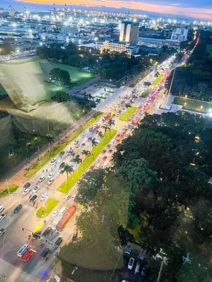 an overhead view of a busy city street at night at Luxury Condo in Manila Bay near US Embassy in Manila