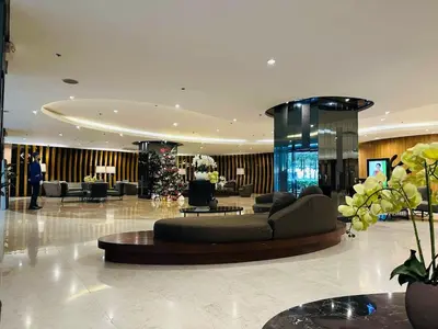 a lobby with a couch and a christmas tree in it at La Deza Shore 2 Residences Pasay Manila in Manila