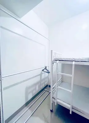 a white bunk bed in a room with a wall at La Deza Shore 2 Residences Pasay Manila in Manila