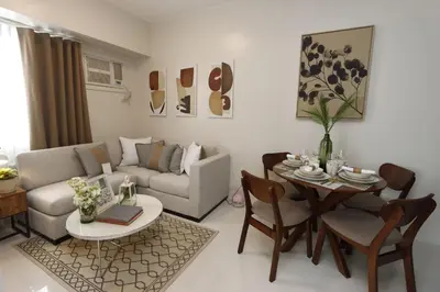 a living room with a couch and a table at 1BR Apt in Manila