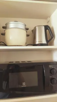 a mortar and pestle sitting on top of a microwave at Holland Park Condominium Accommodation Southwoods Biñan Laguna- Max 4 Persons including kids & toddlers in Biñan