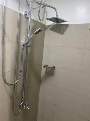 a shower in a bathroom with a shower head at Mall of Asia Staycation by Mochi - SMDC Shore 2 Tower 3 in Manila