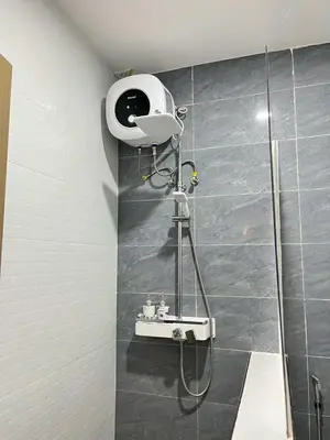 a shower in a bathroom with a sink and a shower at Shiri Pool Villa 1 in Silang