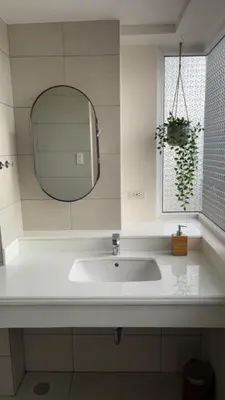 a bathroom with a white sink and a mirror at UG108 Oak Harbor in Manila