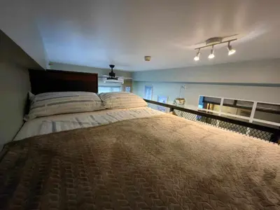 a bedroom with a large bed in a room at Condo Unit at SMDC Breeze Residences with a view in Manila