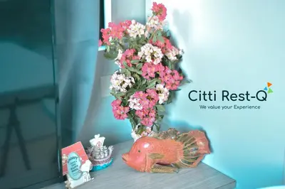 a vase filled with pink and white flowers on a table at Studio City Alabang Pool Access Free for 2 Wifi & Netflix SC3 in Manila