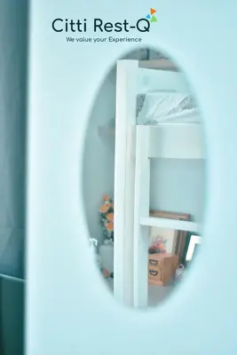 a mirror reflection of a white book shelf at Studio City Alabang Pool Access Free for 2 Wifi & Netflix SC3 in Manila