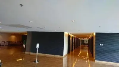 a large lobby with blue gates in a building at On Promo Condo 1BR Makati in Manila
