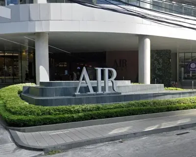 a building with an air sign in front of it at On Promo Condo 1BR Makati in Manila