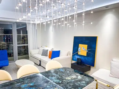 a living room with a couch and a table at Luxury 2BR Penthouse across City of Dreams in Manila