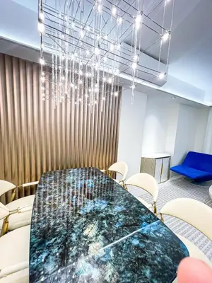 a conference room with a table and chairs at Luxury 4BR Penthouse across City of Dreams in Manila
