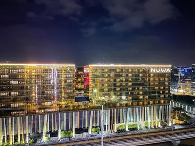 a night view of a nokia building at night at Luxury 4BR Penthouse across City of Dreams in Manila