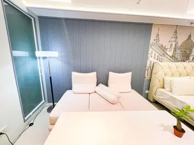 a room with two beds and a couch at Luxury Penthouse across City of Dreams II 7pax in Manila