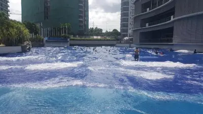 a group of people in a large pool of water at Jellybean's Snuggly Cabin in Manila