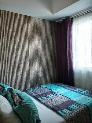 a bed in a room with a window at 1Br Fully Furnished Condo Unit at Light Residences in Manila