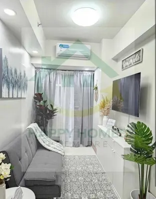 a small bathroom with a shower and a couch at New Crib at Shore 3 in Manila