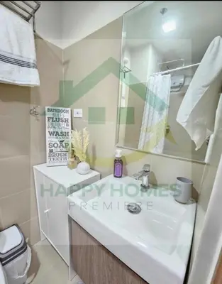 a bathroom with a sink and a mirror at New Crib at Shore 3 in Manila