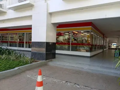a building with a cone in front of a store at Sea Residences by Sonny in Manila