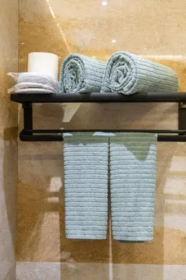 a shelf with towels and towels on it at Best Condo in Makati Near Airport and FREE Parking! in Manila