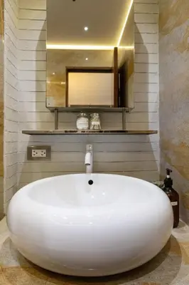 a white bath tub in a bathroom with a mirror at Best Condo in Makati Near Airport and FREE Parking! in Manila