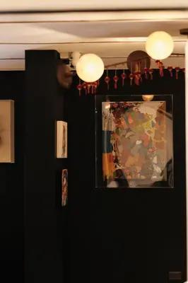 a room with a mirror and a painting on a wall at The Kin House - Poblacion Botique Hotel in Manila